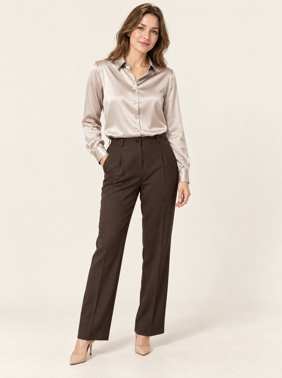 Champagne silk satin shirt tucked into dark trousers, in the studio