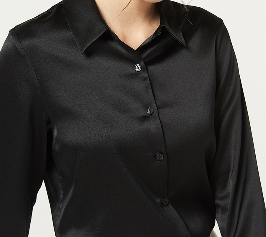 The collar and buttons of the black shirt