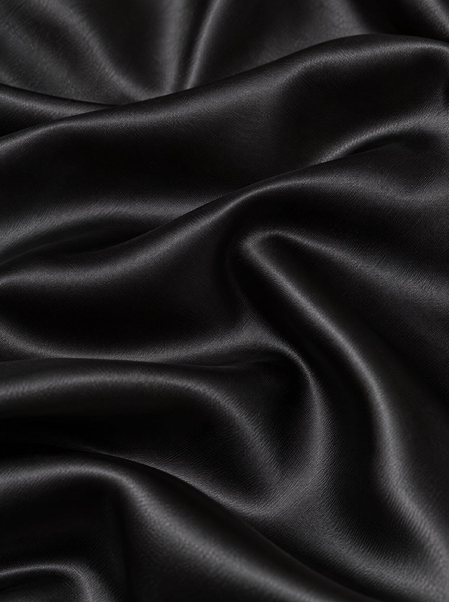 Folds of black silk satin