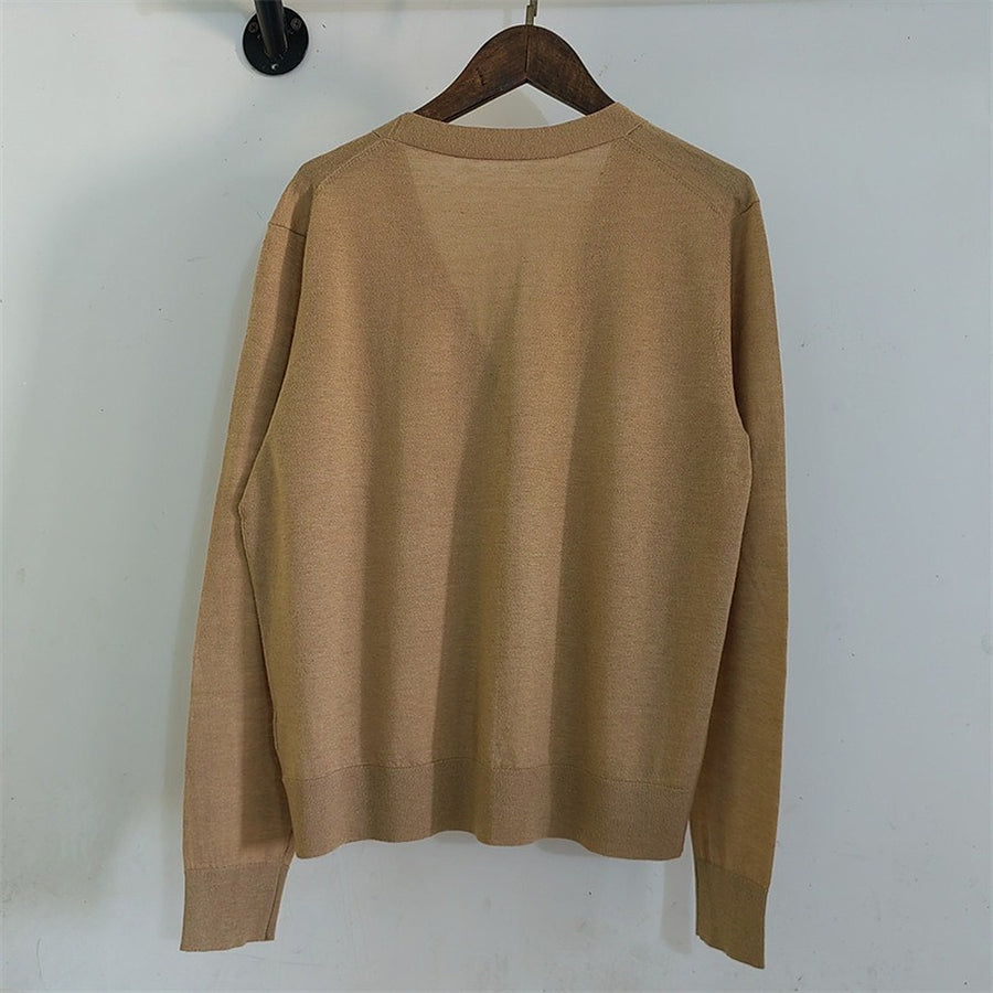 The camel cardigan on a hanger, back