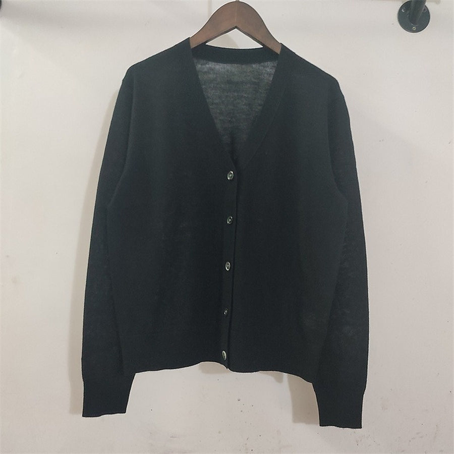 The black cardigan on a hanger, front