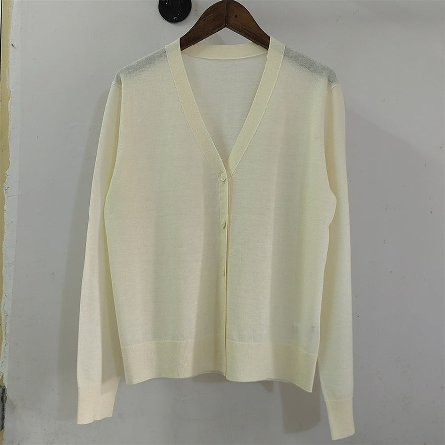 The ivory cardigan on a hanger, front