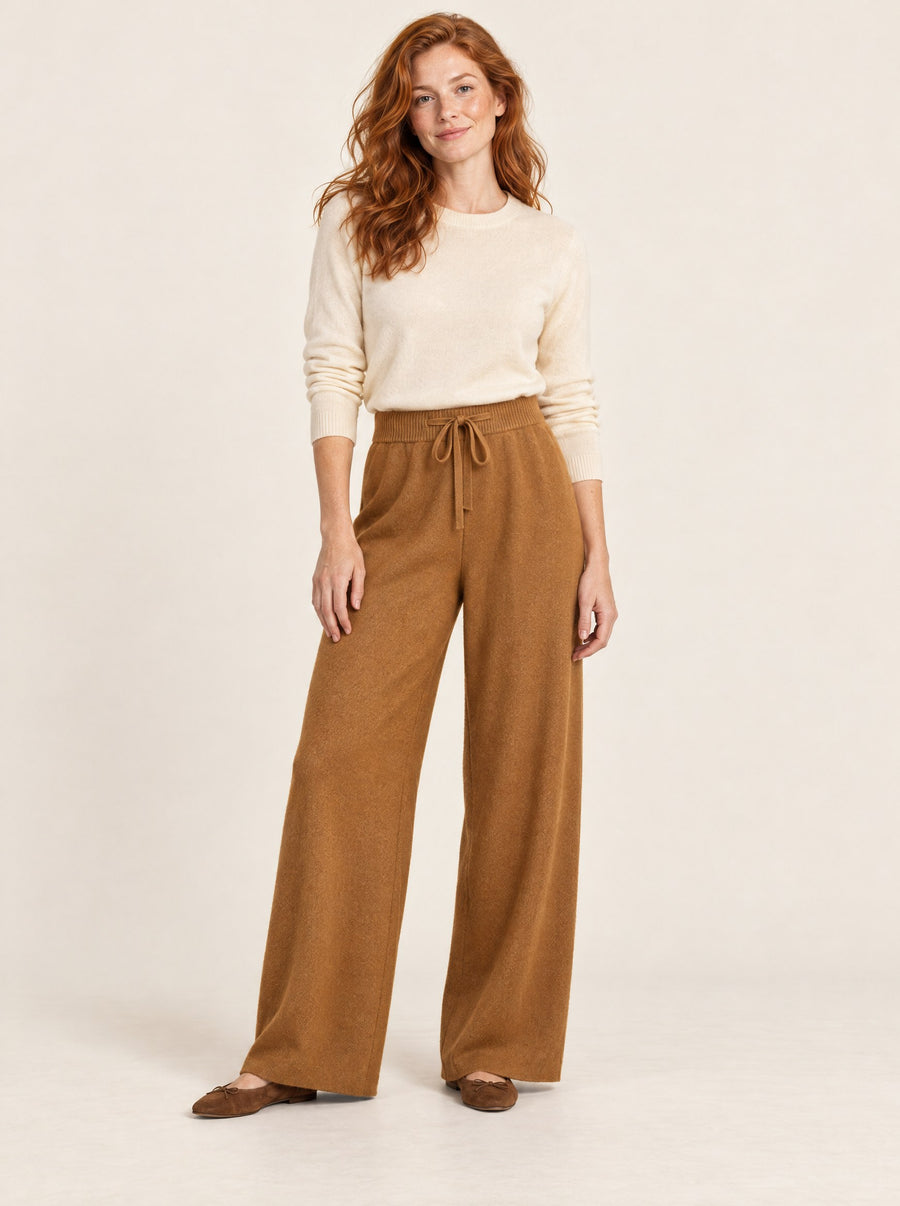 Caramel wide-leg knit wool trousers, full length in the studio