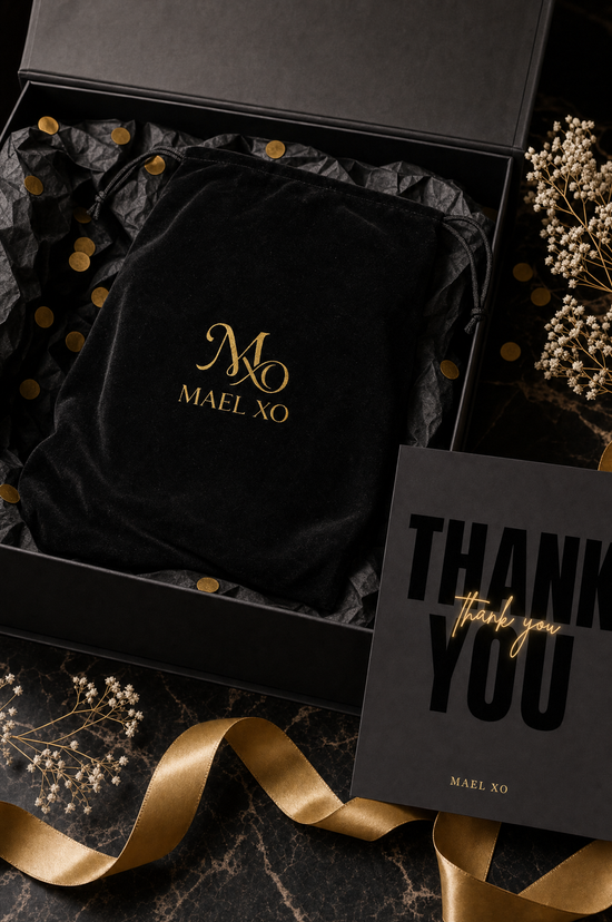 MAEL XO unboxing: black velvet dust bag with gold monogram inside signature gift box