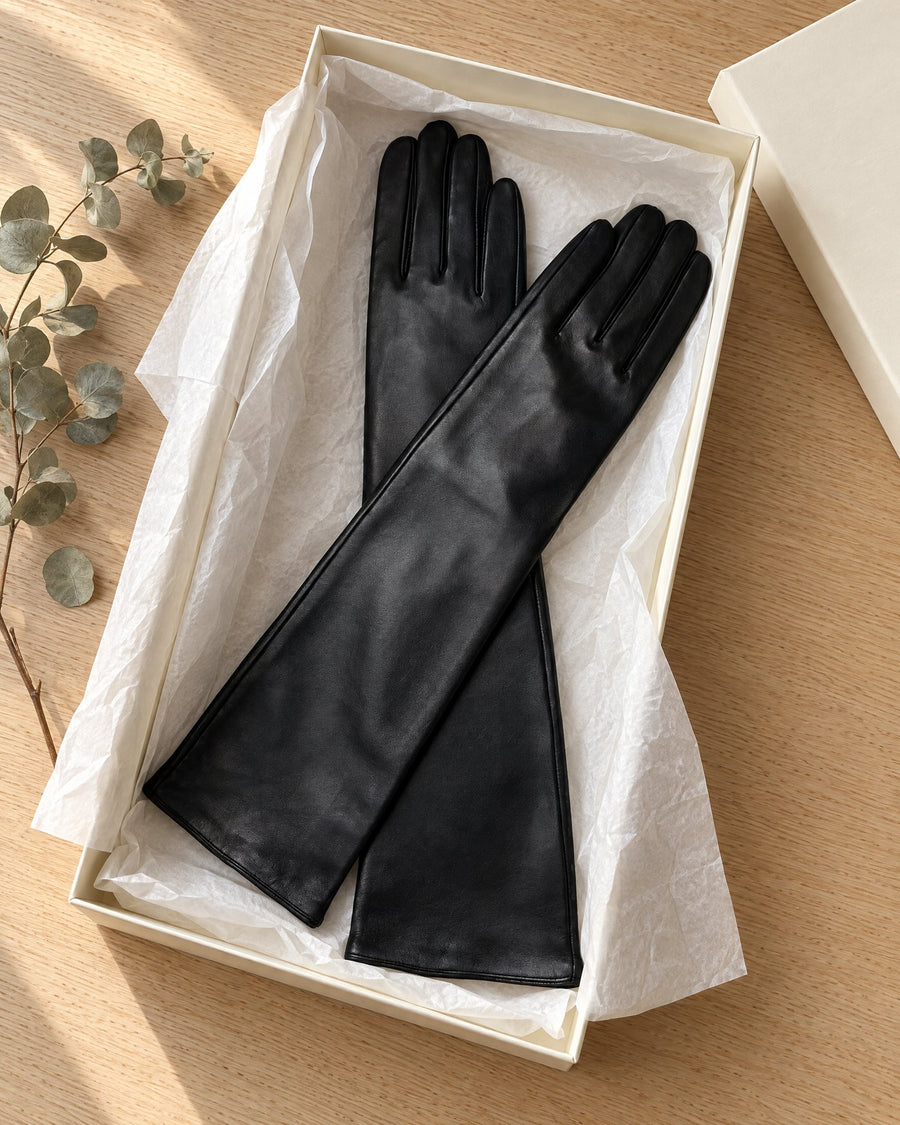 The black gloves in a gift box with tissue
