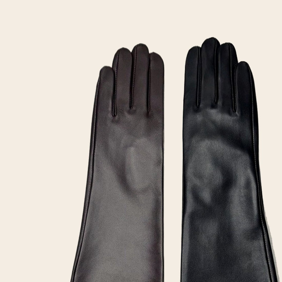 The backs of both gloves, showing three stitched points